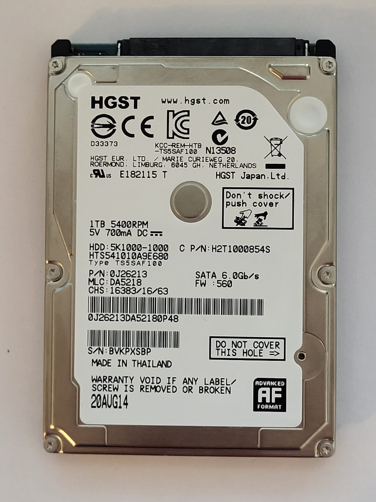 HTS541010A9E680, PN:0J26213, MLC:DA5218, 20 AUG 2014 | HGST 1To 2,5" SATA HDD STK