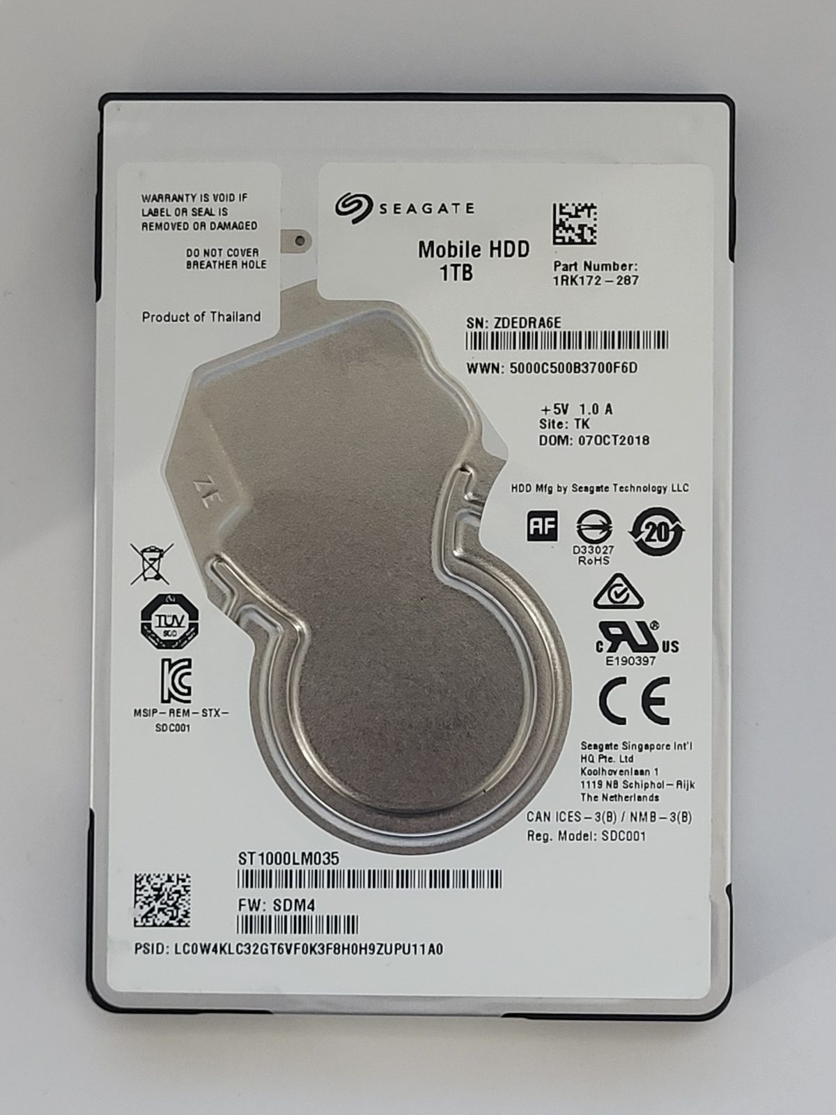 ST1000LM035, PN:1RK172-287, SN:ZDE, TK, FW:SDM4, 07 OCT 2018 | Seagate 1To 2,5" SATA HDD STK