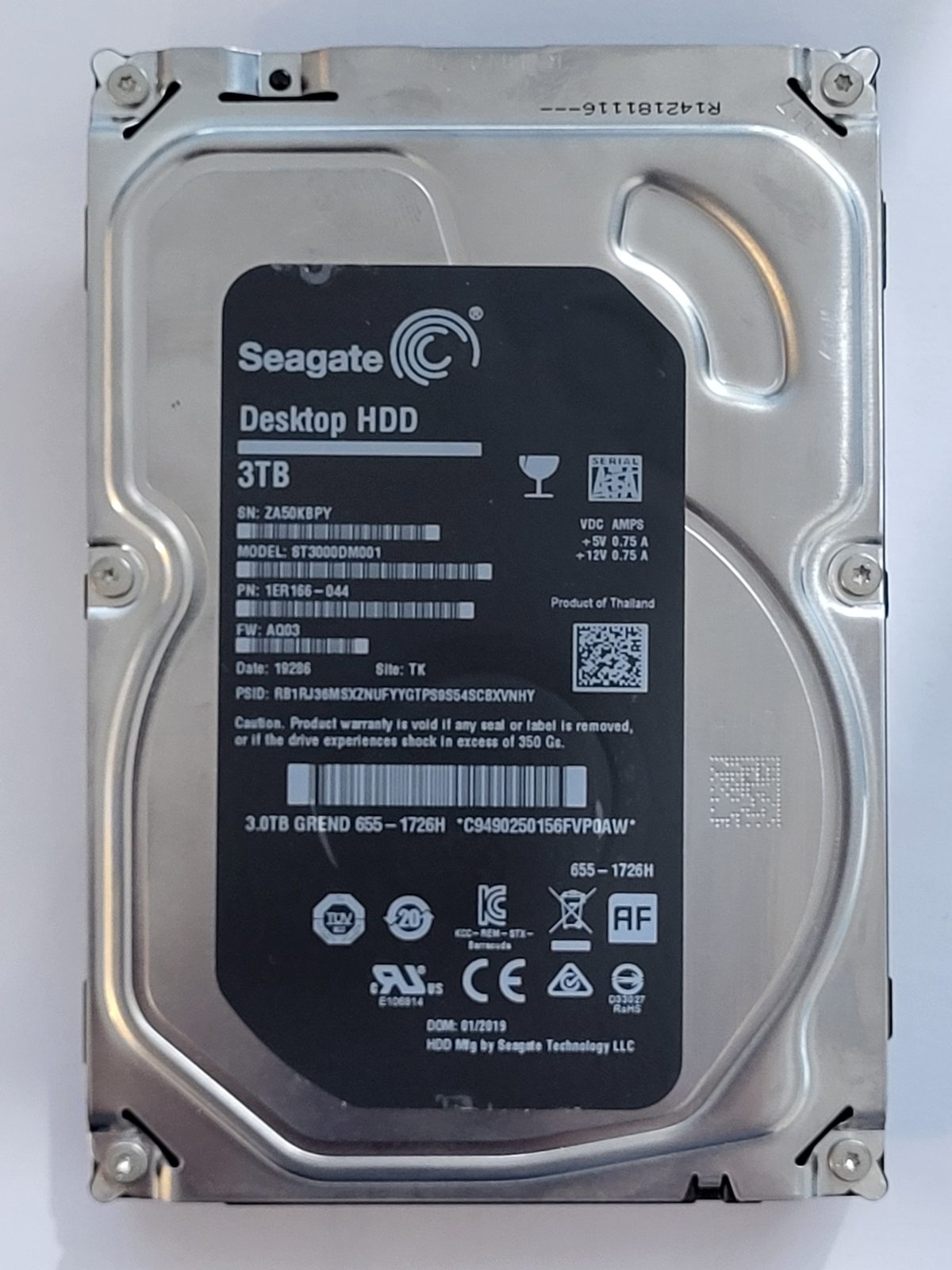ST3000DM001, PN:1ER166-044, SN:ZA5, TK, FW:AQ03, 19286 | Seagate 3To 3,5" SATA HDD STK